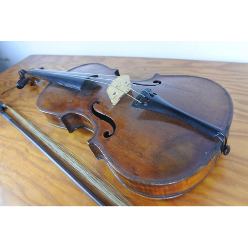 372 - An antique violin stamped to rear, 'Paganini' with bow.