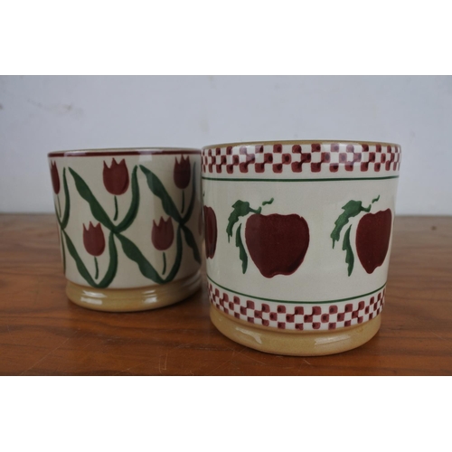 375 - Two Nicholas Mosse Pottery mugs, each measuring 8.5cm tall.