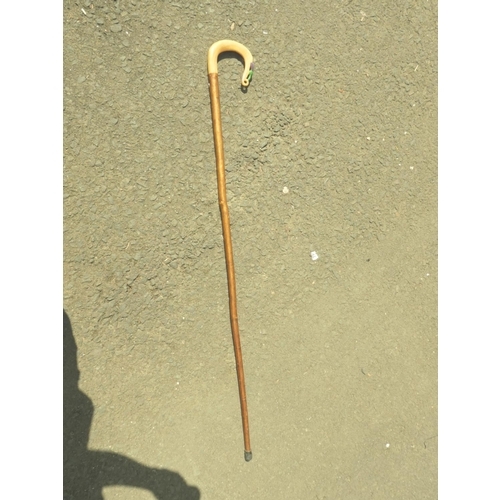 207 - A shepherds crook with decorative thistle design to handle, measuring 130cm.