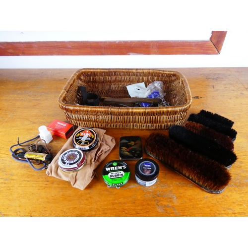 401 - A wicker basket and assortment of shoe cleaning accessories.