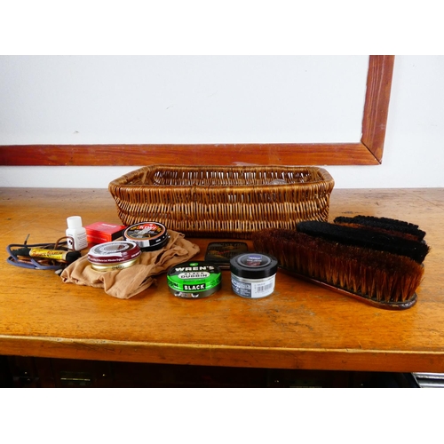 401 - A wicker basket and assortment of shoe cleaning accessories.