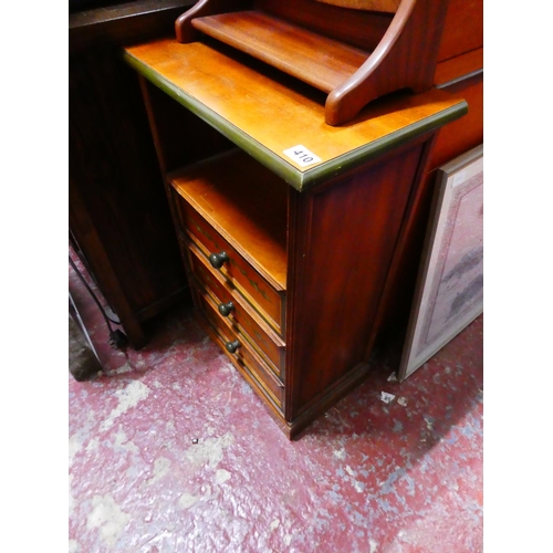 410 - A three drawer cabinet with painted detail.