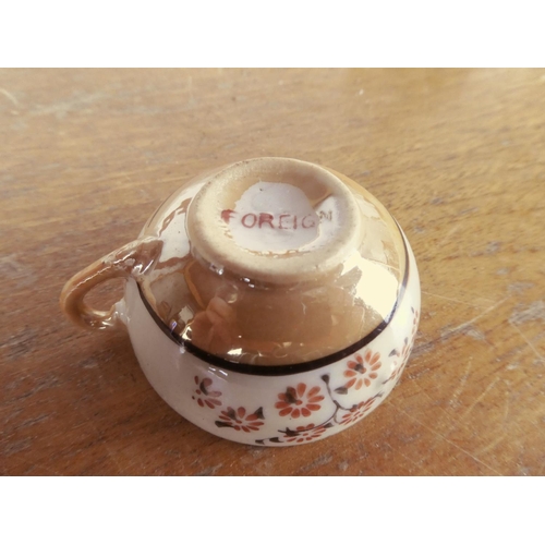 422 - A miniature dolls teaset.