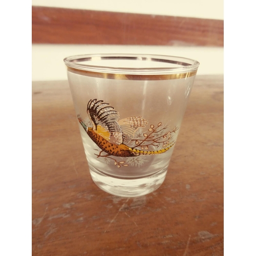 438 - A vintage glass tankard with pheasant detail and four similar glasses.