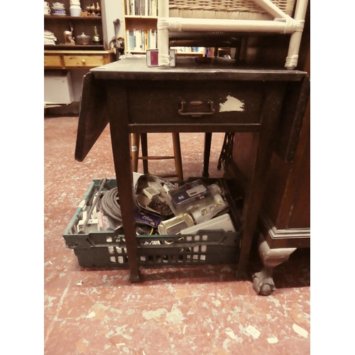 450 - An antique drop leaf table in need of some light restoration.