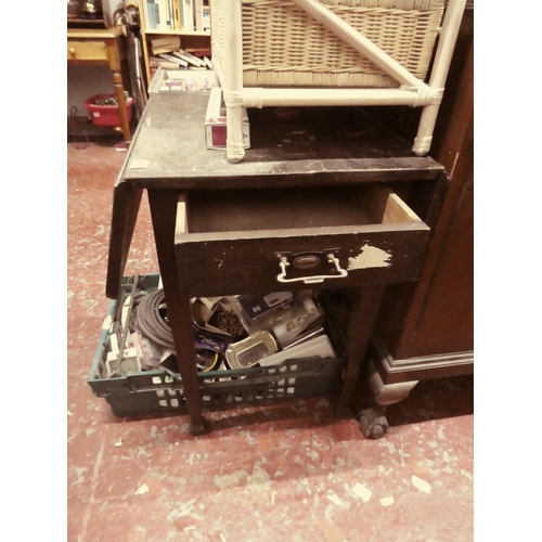 450 - An antique drop leaf table in need of some light restoration.