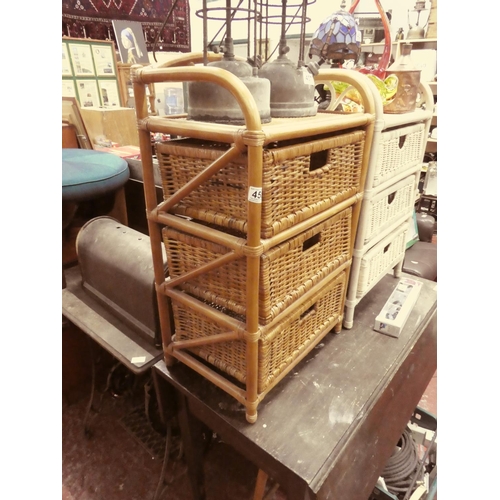 458 - A three drawer wicker cabinet.