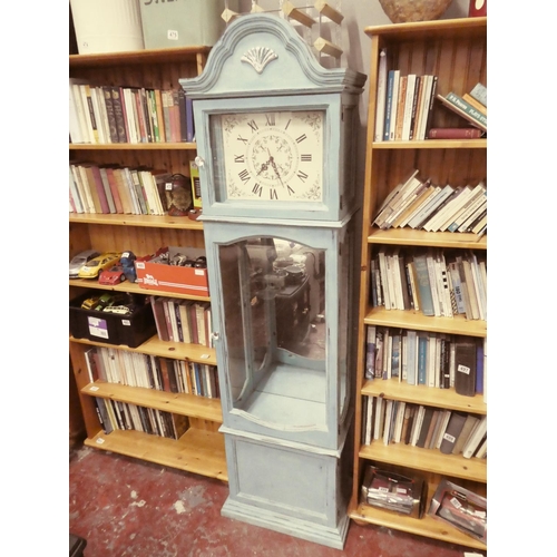 489 - A stunning painted clock case clock with display case.