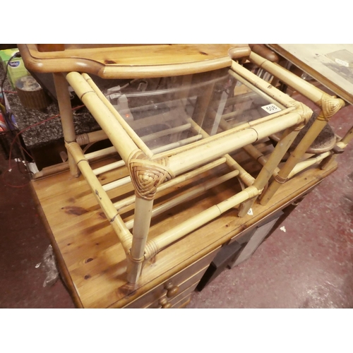 508 - A pair of bamboo and glass occasional tables.