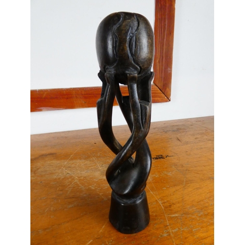 526 - Four decorative African style wood carved figures.