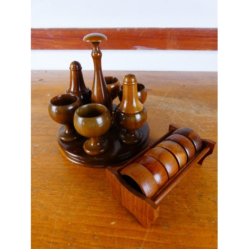 528 - A Mid Century egg cup and condiment set, along with a set of teak napkin rings.