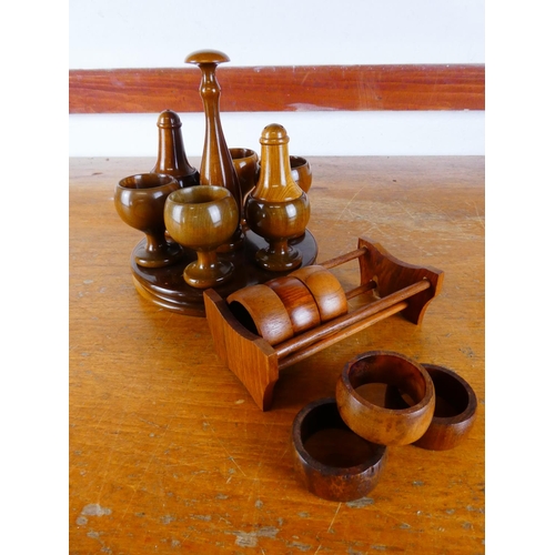 528 - A Mid Century egg cup and condiment set, along with a set of teak napkin rings.