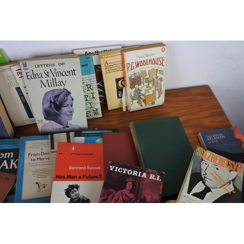 553 - A large assortment of books to include authors such as, 'P.G. Wodehouse', 'Robert K. Massie', 'Bertr... 