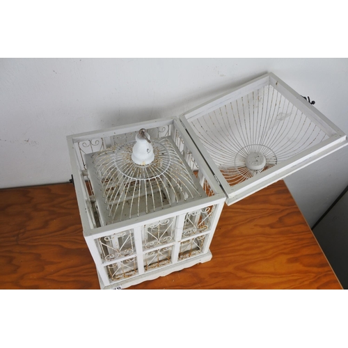 570 - Two wooden and metal bird cage style storage boxes.