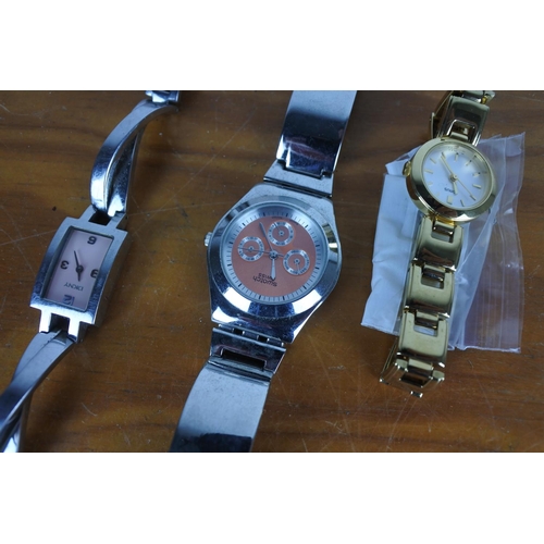 580 - A Swatch ladies wrist watch, a DKNY ladies wrist watch and a Lorus ladies wrist watch.