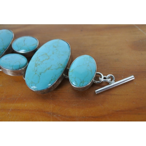 592 - A sterling silver and turquoise bracelet.