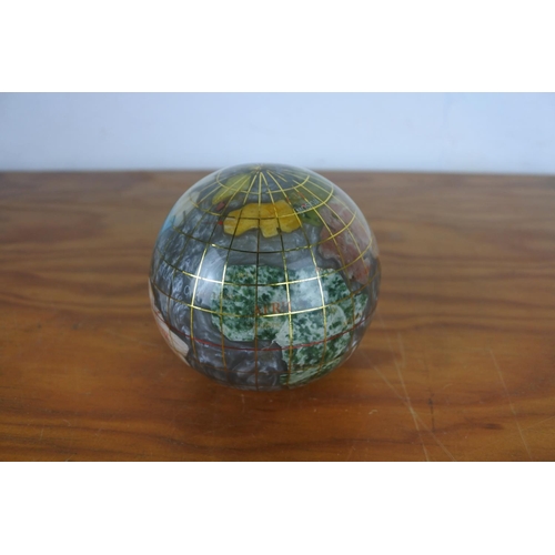 609 - A small globe of the world made from various precious stones/marble.