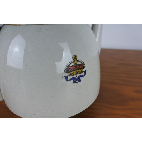 610 - An antique teapot 'For Right & Freedom' (a/f).