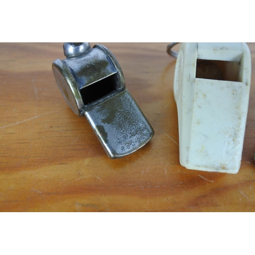 615 - A vintage ACME cream whistle and two others.