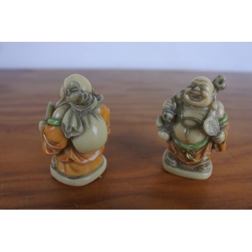 624 - Two Chinese figurines of Buddhas.