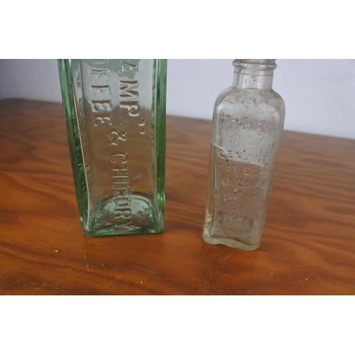 627 - A Paterson's glass bottle and a Day Son & Hewitts, Dublin glass bottle.