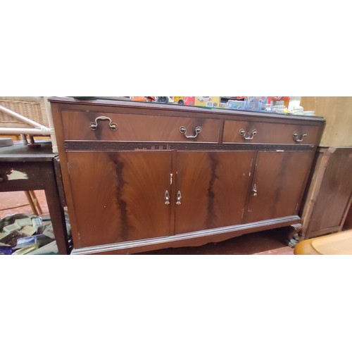 440B - An antique sideboard with gallery back, claw feet and a glass protective top.