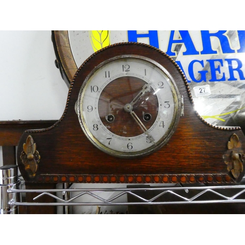 26 - A vintage oak cased mantle clock.