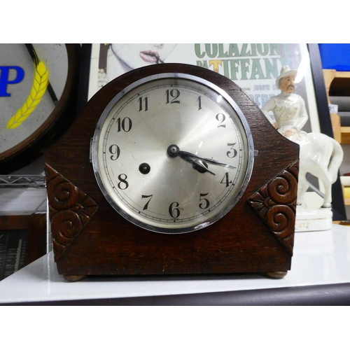 28 - A vintage oak cased mantle clock.