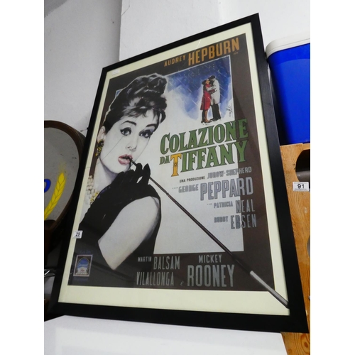 29 - A large Audrey Hepburn framed Breakfast at Tiffanys print (glass damaged).