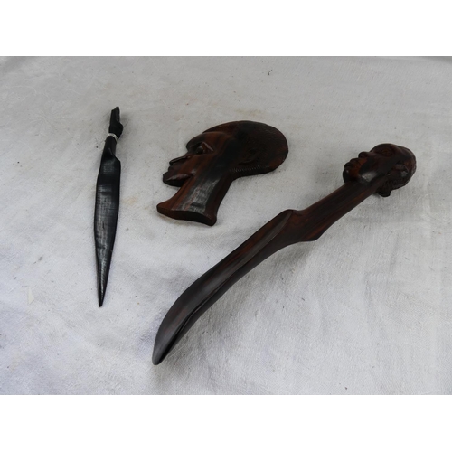 45 - An African wooden bust wall plaque, letter opener and shoe horn.