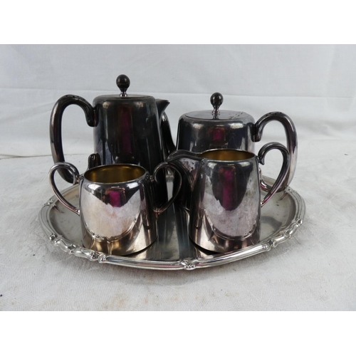 53 - A four piece Viners of Sheffield tea service on a stainless steel tray.