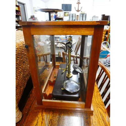 574 - A cased set of antique/ vintage chemists scales.