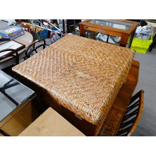 575 - A large wicker footstool.