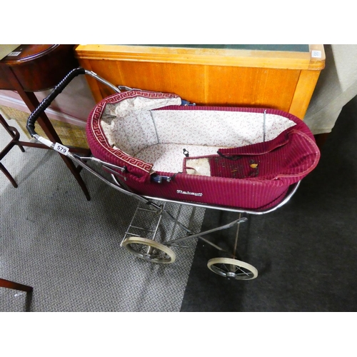 579 - A vintage dolls pram.