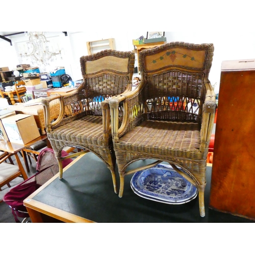 582 - A pair of decorative cane chairs.