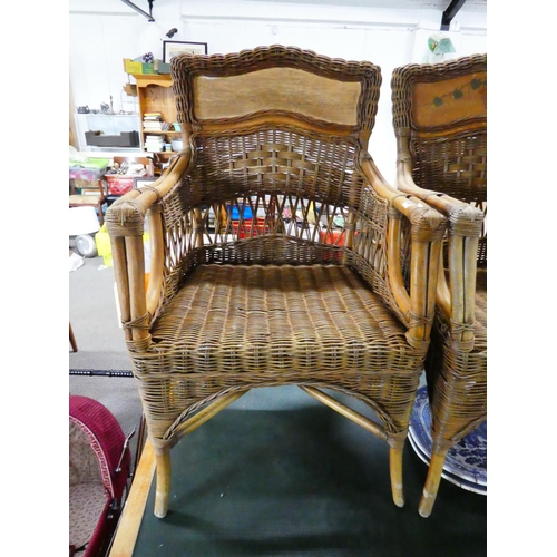 582 - A pair of decorative cane chairs.