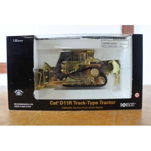 A stunning boxed 75th Anniversary edition Norscot CAT D11R Track-Type gilt tractor scale 1:50.