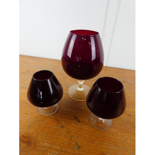 107 - A stunning set of three vintage ruby glass goblets.