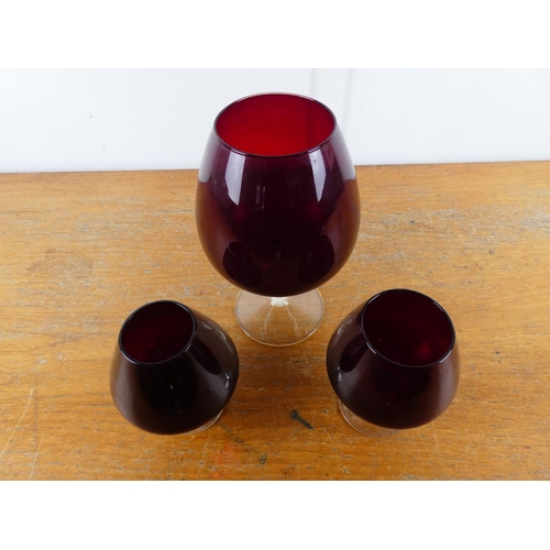 107 - A stunning set of three vintage ruby glass goblets.