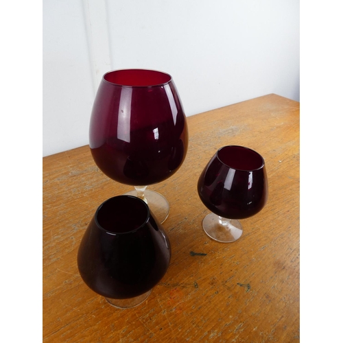 107 - A stunning set of three vintage ruby glass goblets.