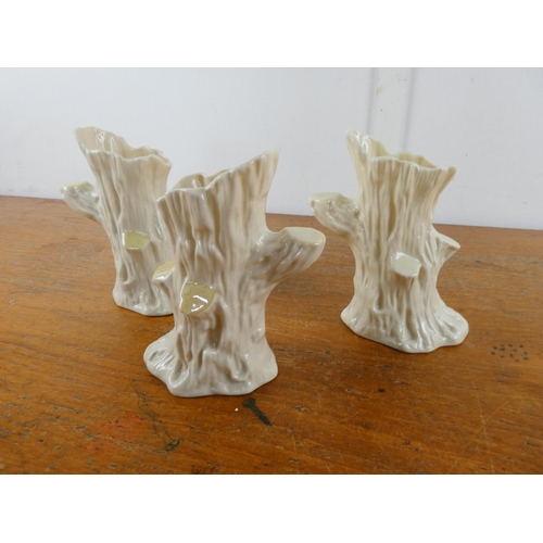 127 - Three Belleek pottery 'Tree Stump' vases.