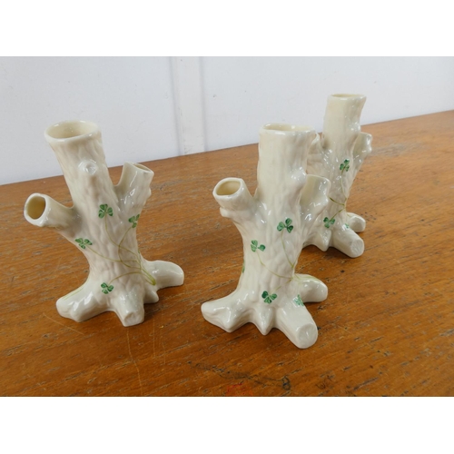 128 - Three Belleek pottery 'Tree Stumps with shamrock pattern vases.