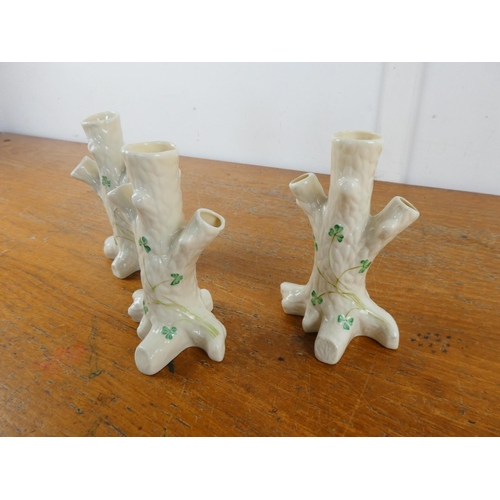 128 - Three Belleek pottery 'Tree Stumps with shamrock pattern vases.