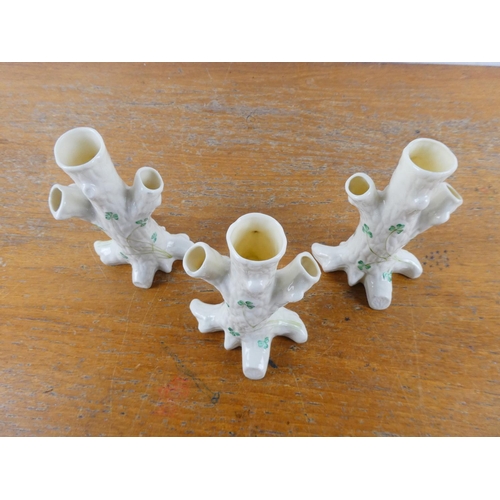 128 - Three Belleek pottery 'Tree Stumps with shamrock pattern vases.