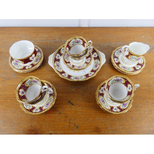 130 - A stunning Royal Albert 'Lady Hamilton' tea set with cake plate, milk jug and sugar bowl.