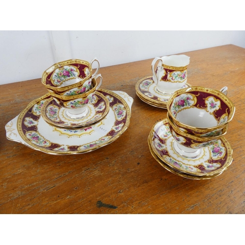 130 - A stunning Royal Albert 'Lady Hamilton' tea set with cake plate, milk jug and sugar bowl.