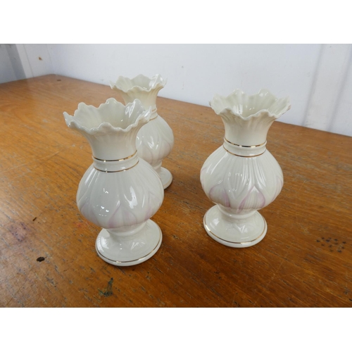 132 - Three Belleek pottery 'Lotus Blossom' spill vases.