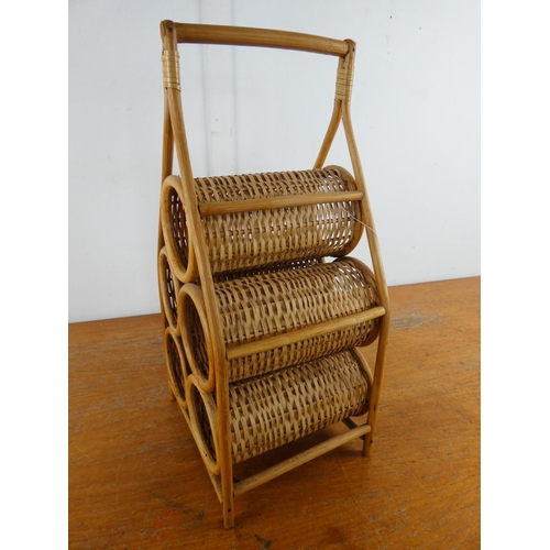 141 - A vintage bamboo and wicker bottle holder.