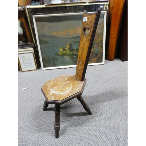 152 - An antique spinning chair with Celtic scroll and shamrock detail and depicting the picture of Monast... 