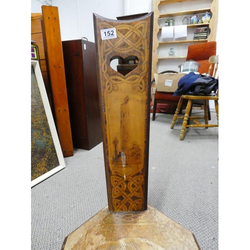 152 - An antique spinning chair with Celtic scroll and shamrock detail and depicting the picture of Monast... 